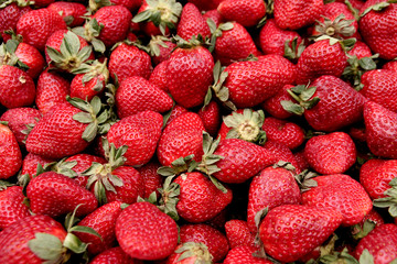A pile of fresh strawberries,