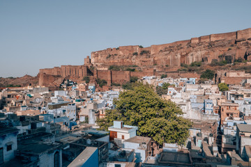 Mehrangarh Fort with the blue city of Jodhpur, Rajasthan, India in the front