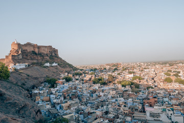 Mehrangarh Fort with the blue city of Jodhpur, Rajasthan, India in the front