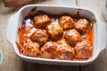 Baked pork meatballs with parmesan in tomato sauce 