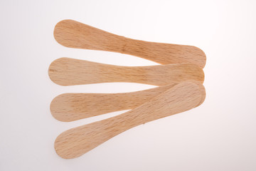 Wooden ice-cream sticks on white background