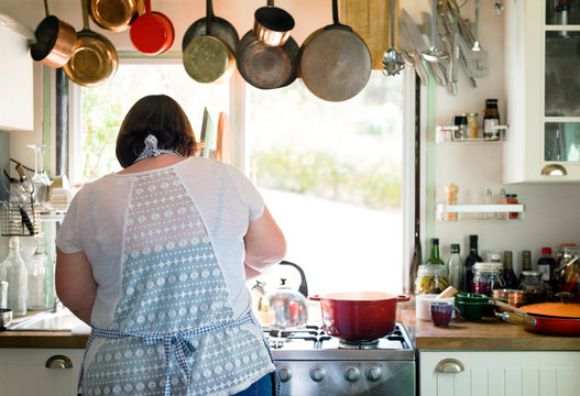 Woman preparing dinner in the kitchen