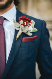 Close up of a groom with a boutonniere