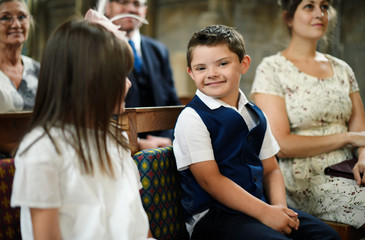 Cute little boy waiting for the bride to arrive