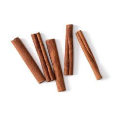 Cinnamon sticks isolated on white background closeup. Canella spice. Aromatic condiment background. Flat lay, top view.