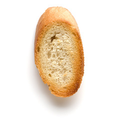 Toasted baguette slice isolated on white background close up.  Toast, crouton.   Top view.