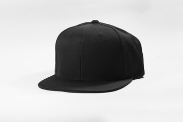 Black snapback hat cap flat visor isolated on white background.