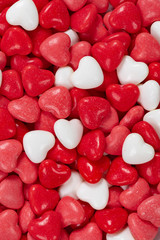 Close up of red, pink and white heart shaped candy