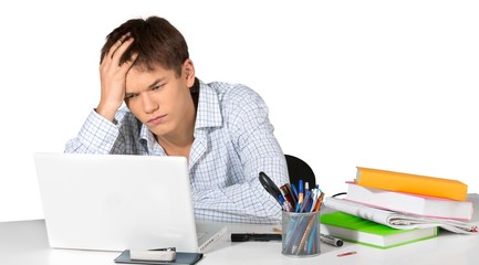 Teen male student frustrated doing school work