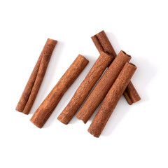 Cinnamon sticks isolated on white background closeup. Canella spice. Aromatic condiment background. Flat lay, top view.