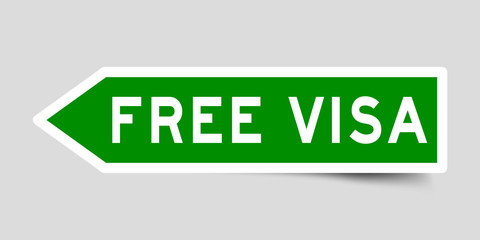 Arrow shape green color sticker in word free visa on gray background