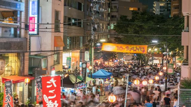 Timelapse of Unrecognizable Crowd at Azabu Juban Festival in Tokyo -Tilt Up-