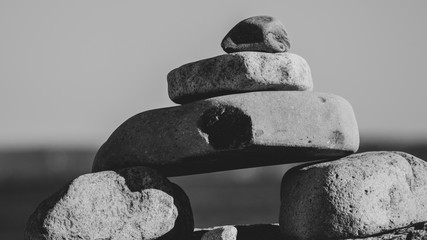little stone inukshuk pile closeup, beach, sand, rocks, stones, art