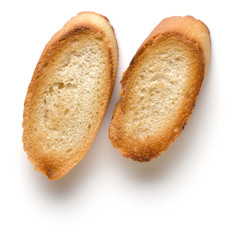 Toasted baguette slices isolated on white background close up.  Toast, crouton.   Top view.