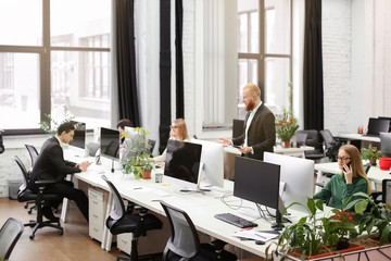 Young people working in modern office