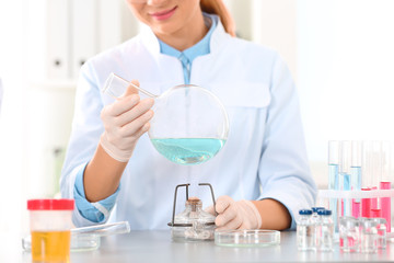 Scientist working in laboratory, closeup. Research and analysis