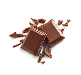 Pieces of tasty milk chocolate on white background