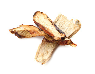 Fototapeta premium Slices of dried mushrooms on white background