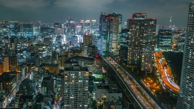Timelapse Overview of Congested Tokyo Cityscape at Night -Pan Left-