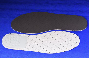  Shoe Insoles on blue  background,reverse