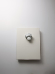Blank book and white camera on white background