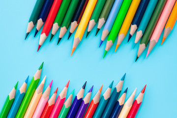 Diversity concept. row of mix color pencil on blue background