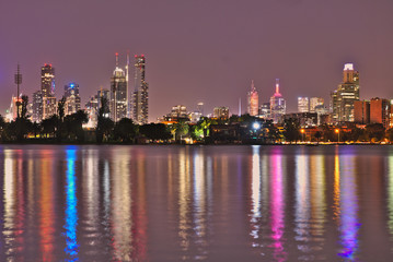 Fototapeta premium The Melbourne Skyline at night as seen from Albert Park Lake