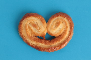 Puff pastry cookies on colorful background
