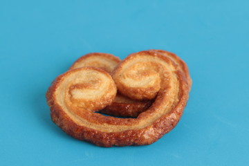 Puff pastry cookies on colorful background