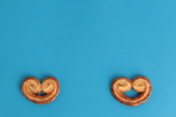 Puff pastry cookies on colorful background