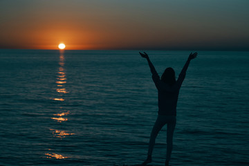 woman silhouette sea sunset