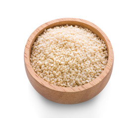  wooden bowl of sesame seeds and a scoop on a white background