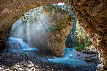 Johnston Canyon cave in Spring season with waterfalls, Johnston Canyon Trail, Alberta, Canada. - 243969002