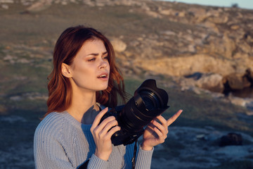 woman with camera nature photography