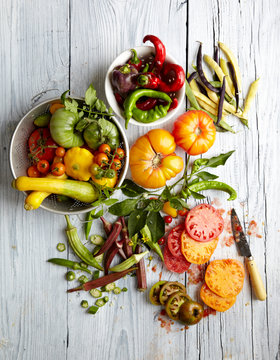 Overhead view of fresh vegetables on wooden table