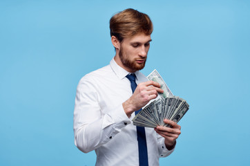 man with money on blue background