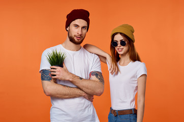 young couple on orange background