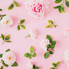 Floral pattern with roses and leaves on pink background. Flat lay, top view. Valentines day