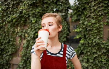 woman drinking coffee in the park