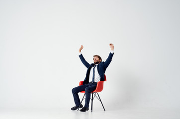 man sitting on a red chair