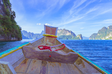 Wooden boat on sailing travel in Ratchaprapa Dam and Cheow Larn Lake, Khao Sok nature beautiful in Thailand