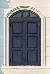 Large blue wooden window. The old vintage retro window made of hardwood.