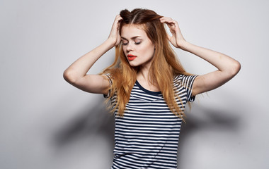Naklejka premium woman with eyes closed holding her head