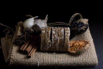 palm sugar with garlic,dry bael, star anise isolate on black background