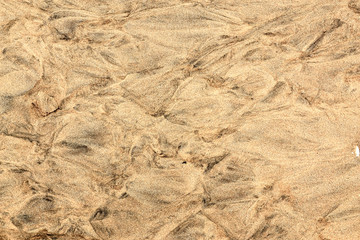 Closeup of sand pattern of a beach, beautiful sand beach