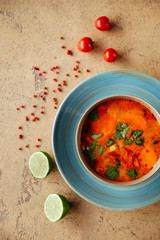 Tom Yam kung Spicy Thai soup with shrimp, seafood, coconut milk and chili pepper in bowl copy space
