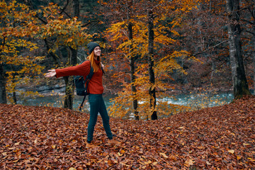 woman with backpack in the forest