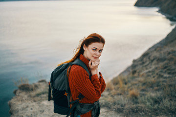 woman with a backpack at the sea