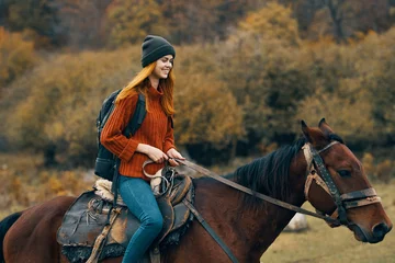 Foto op Canvas woman riding a horse © SHOTPRIME STUDIO