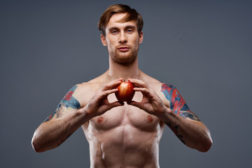 muscular man with apple